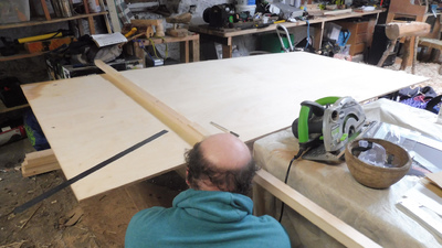 Cian measuring a large 12mm ply board