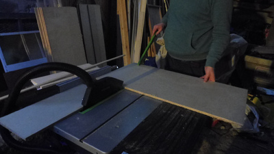 Snipping the cross-cut pieces into side panels with a table saw