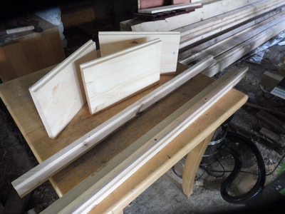 Panel parts laid out on a table: three 8-frame Rose panels with rebates + long National "fillets" plus an extension to National depth