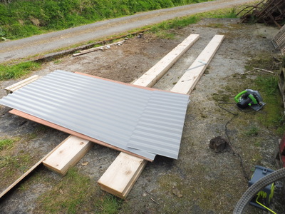 A cut panel of corrugated roofing