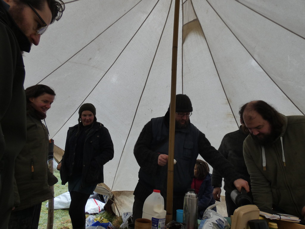 bell tent interior with cuppa in full swing